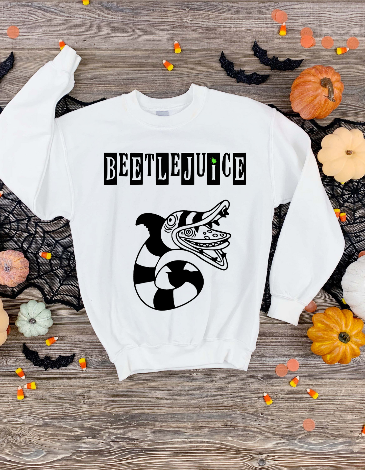 Beetlejuice, Beetlejuice, Beetlejuice! Unleash your inner ghost with this made-to-order Halloween set! Front and back designs inspired by the classic movie